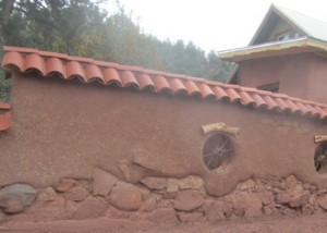 An Adobe wall and home