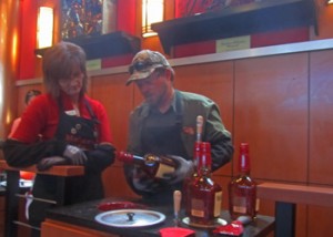 Makers Mark still hand dips every bottle so they are individual.  If you bought a bottle you could dip your own.