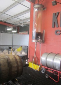 It is being pumped from the the tray under the barrel into that clear container on the wall - then it is off to bottling!