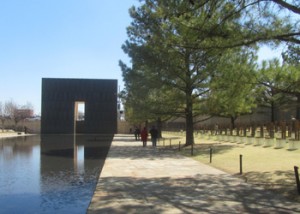 The reflecting pool with the 9:01 gate and the empty chairs
