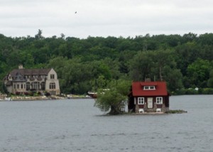 Now that is a cottage!  More like a houseboat that isn't floating!  There isn't much land to walk around on